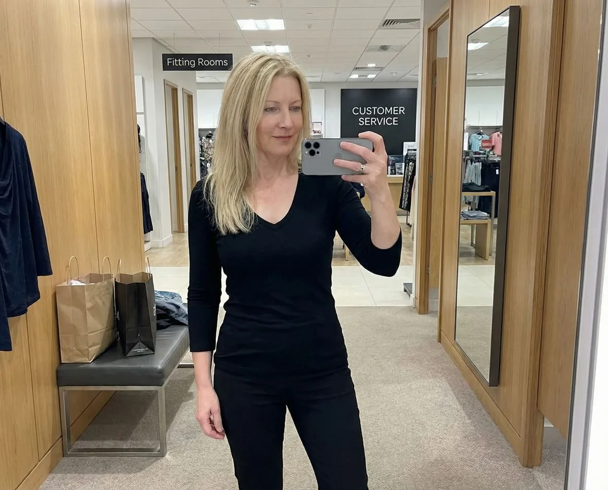 Lydia in a shop fitting room